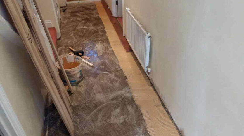 3 The Engineered Oak Dark Smoked Hand Beveled Brushed UV Oiled Boards Being Glued To The Substrate With a MS Polymer Adhesive