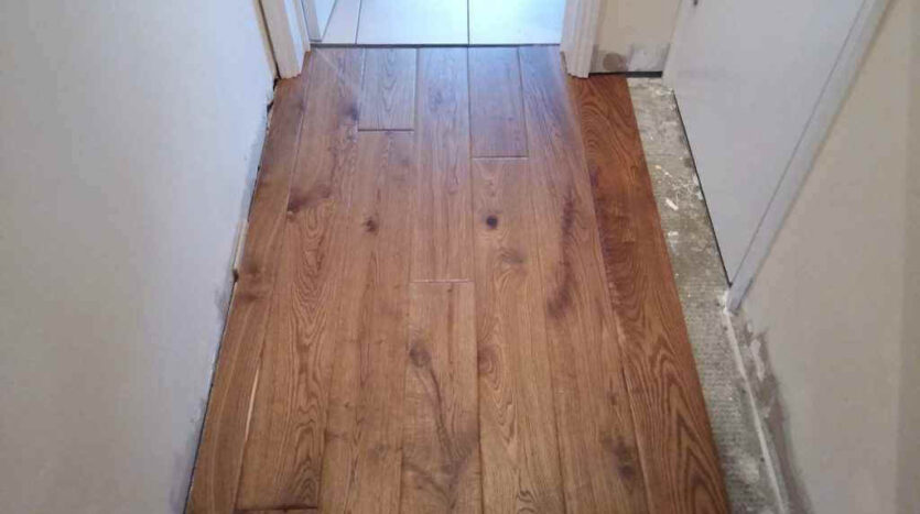 4 The Floor Boards Being Fitted Under The Door Frames and Architraves 1