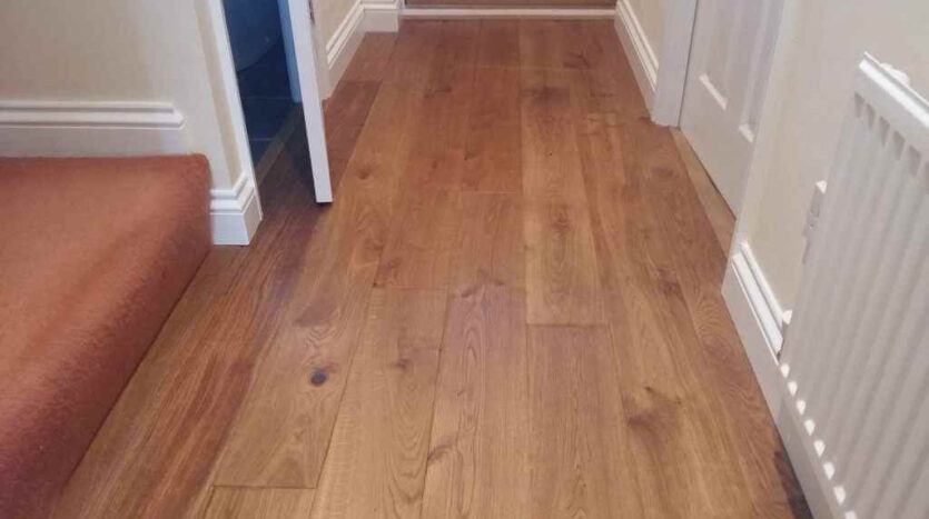 6 The Solid Oak Thresholds Being Fitted Between The Room Junctions