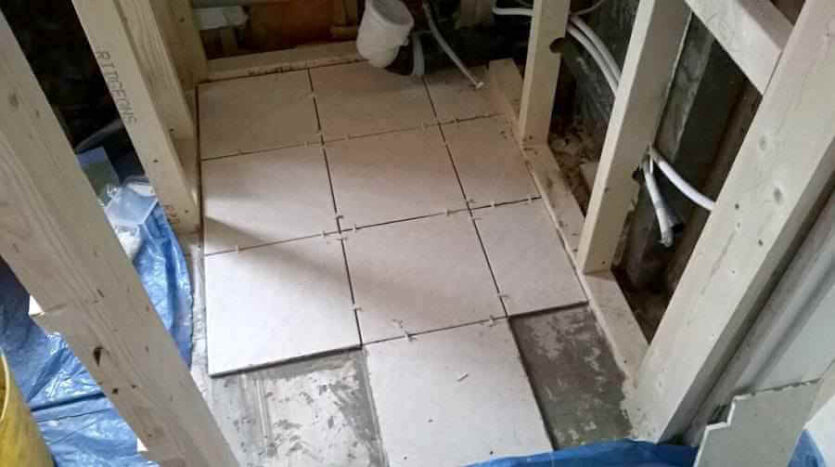 couple of cuts left to complete tiling in WC