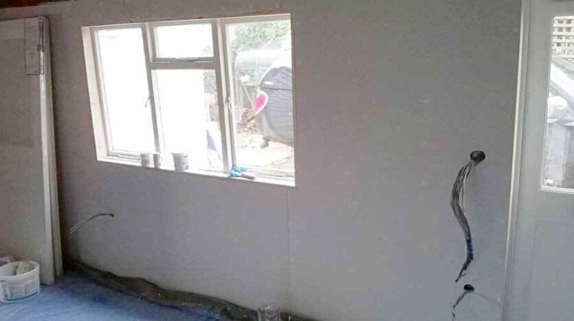 eastern wall of shop with new dry lined membraned and and insulated covering 