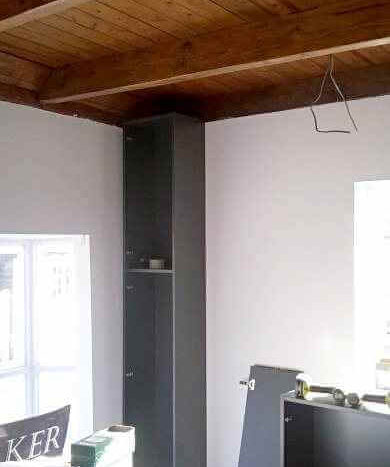 first tall broom cupboard cabinet installed in shop