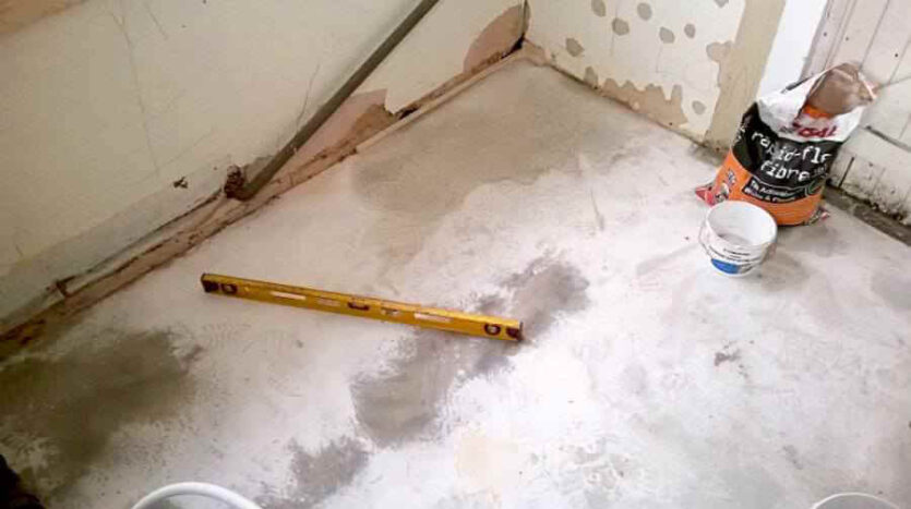levelling compound has been poured and is now set ready for tiling in the kitchen area