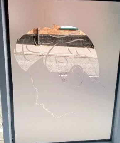 male frosting in bay window