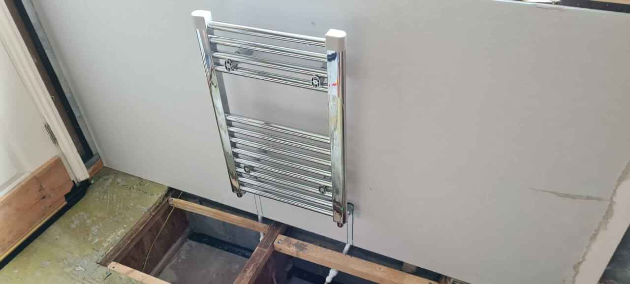 Drywall and radiator fitted to outside wall