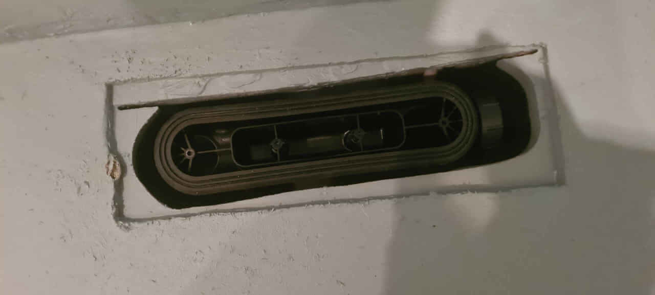 Having carefully aligned the shower drain pipe the shower drain itself is now solvent welded into position