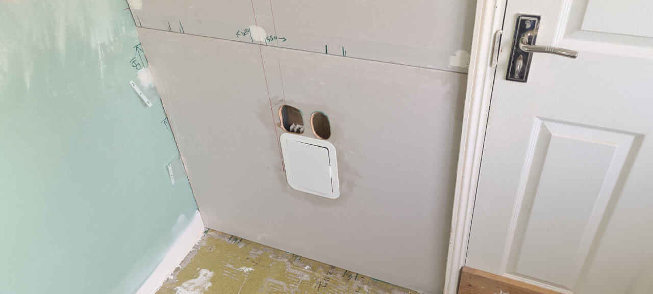 Installing access panels in drywall for basin valves