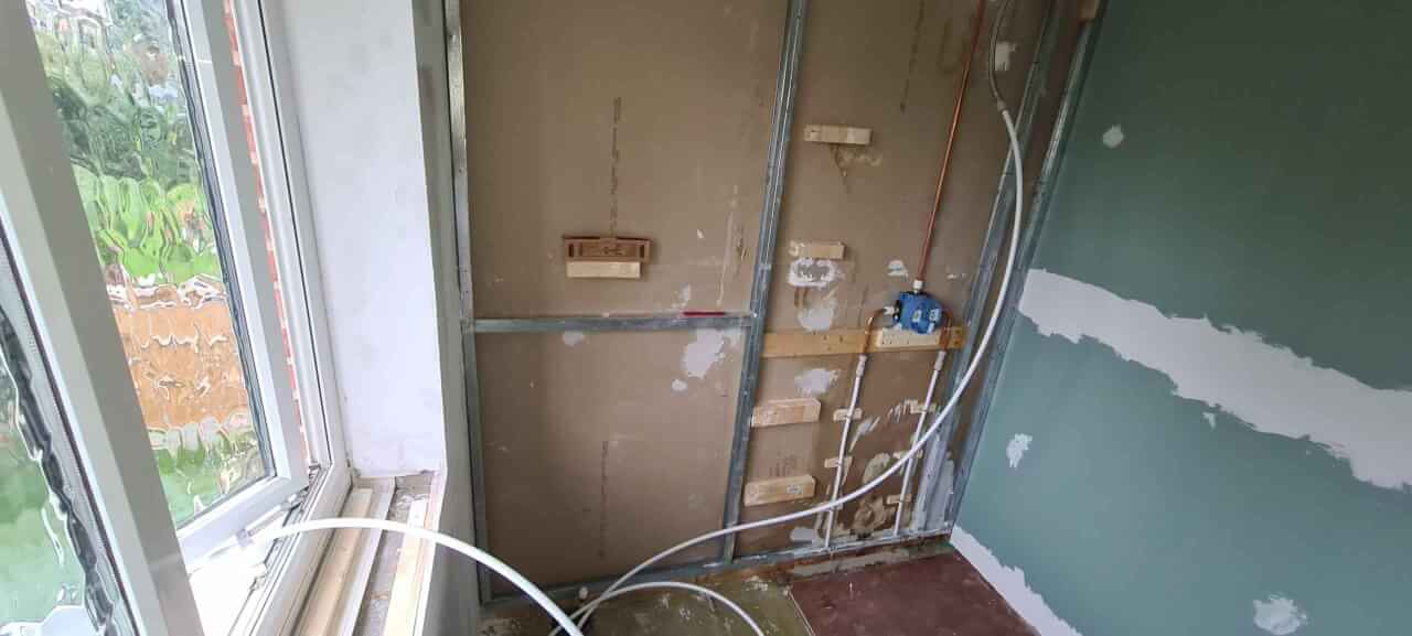 Shower valve plumbing installed and being tested