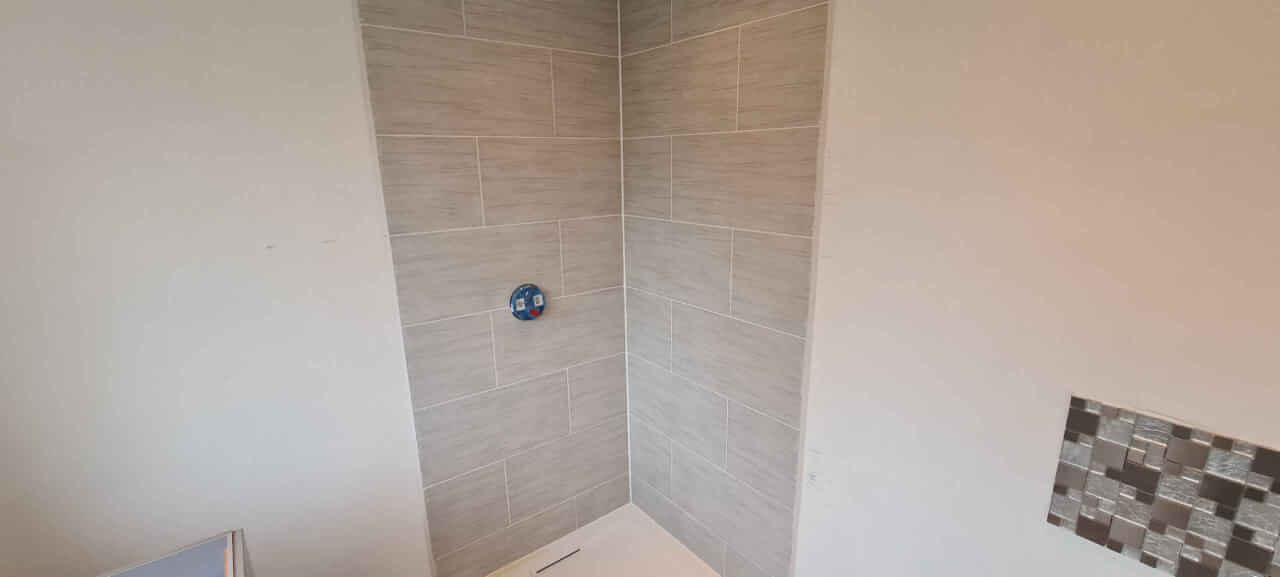 Wall and floor tiles grouted with epoxy grout