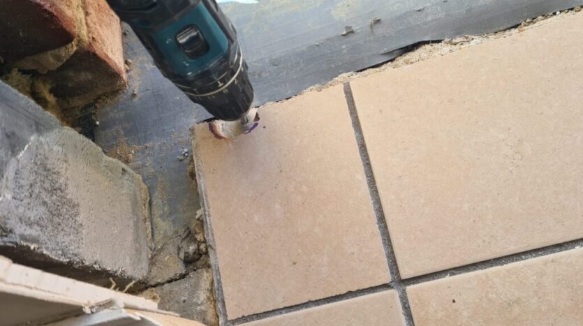 drilling holes for sill metal tie straps scaled e1659642495100