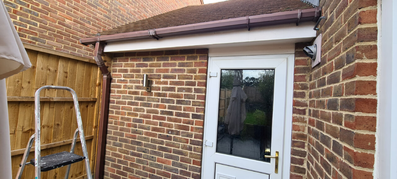 Old guttering and downpipe before replacement
