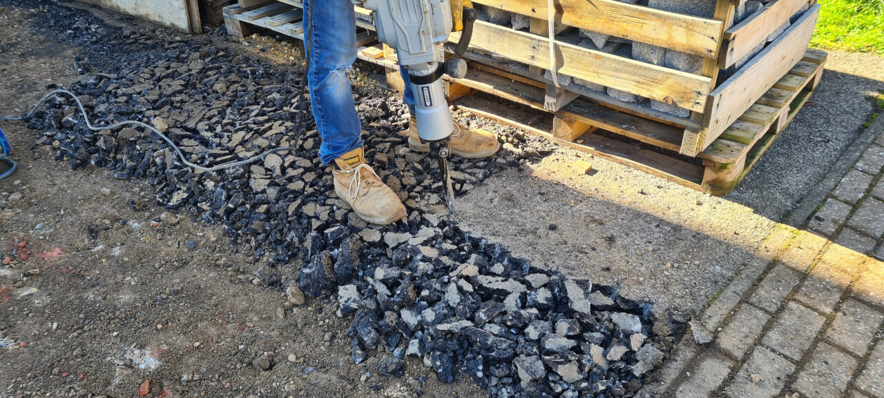 Breaking out the tarmac drive with a jack hammer