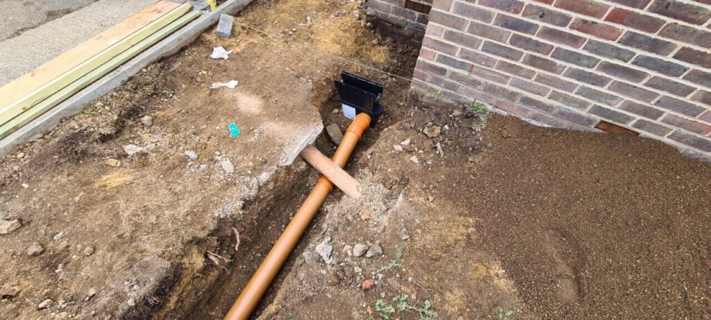Drainage pipe with correct fall from sump to soak away pit