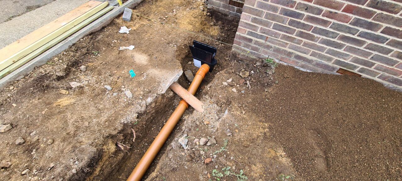 Drainage pipe with correct fall from sump to soak away pit