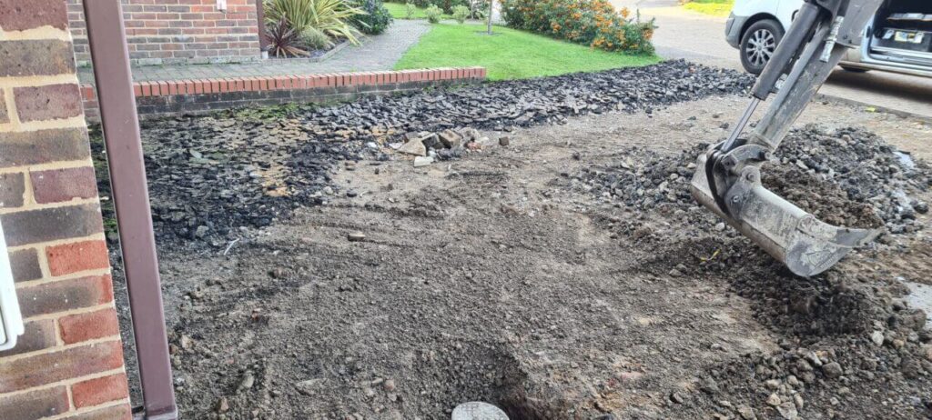 Site being graded with the digger and large bucket