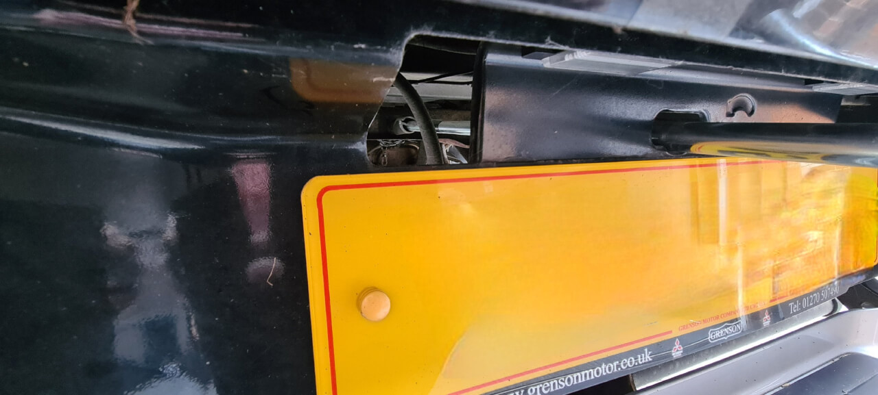 Jack handle insertion point in rear bodywork for spare wheel winch mechanism