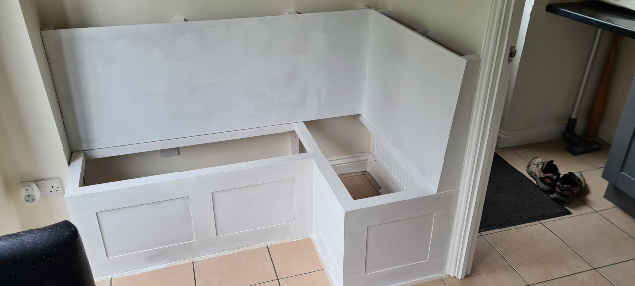 Priming the bare wood and MDF board with white MDF primer paint with grain filling properties