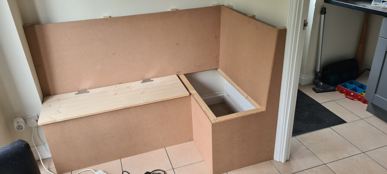The 10mm hardboard panels to cover the bench carcass have been cut to the shape of the frame and pinned onto the studwork