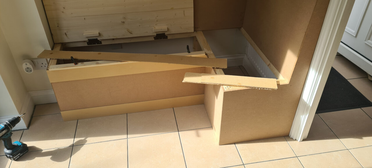 The decorative battens being cut to size and glued onto the panelling to give a board and batten effect