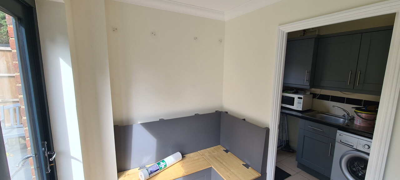 Cabinets removed and walls filled and prepped ready for wallpapering