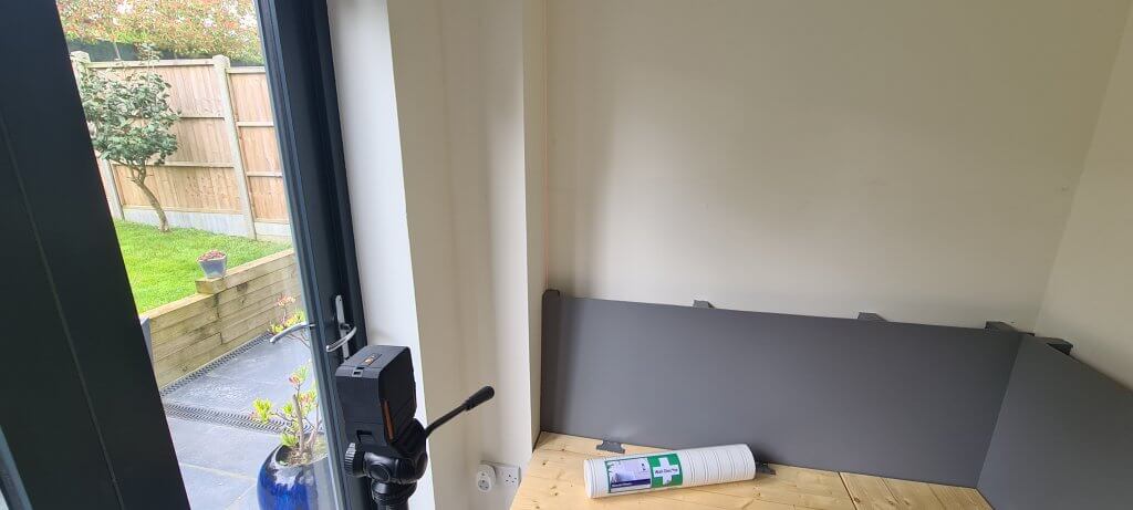 Checking the walls for square with a laser level