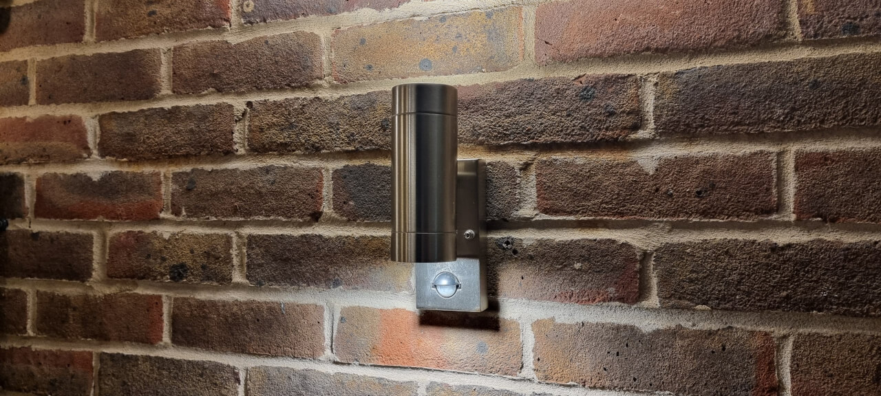 Outdoor up and down wall light in stainless steel with warm white led bulb